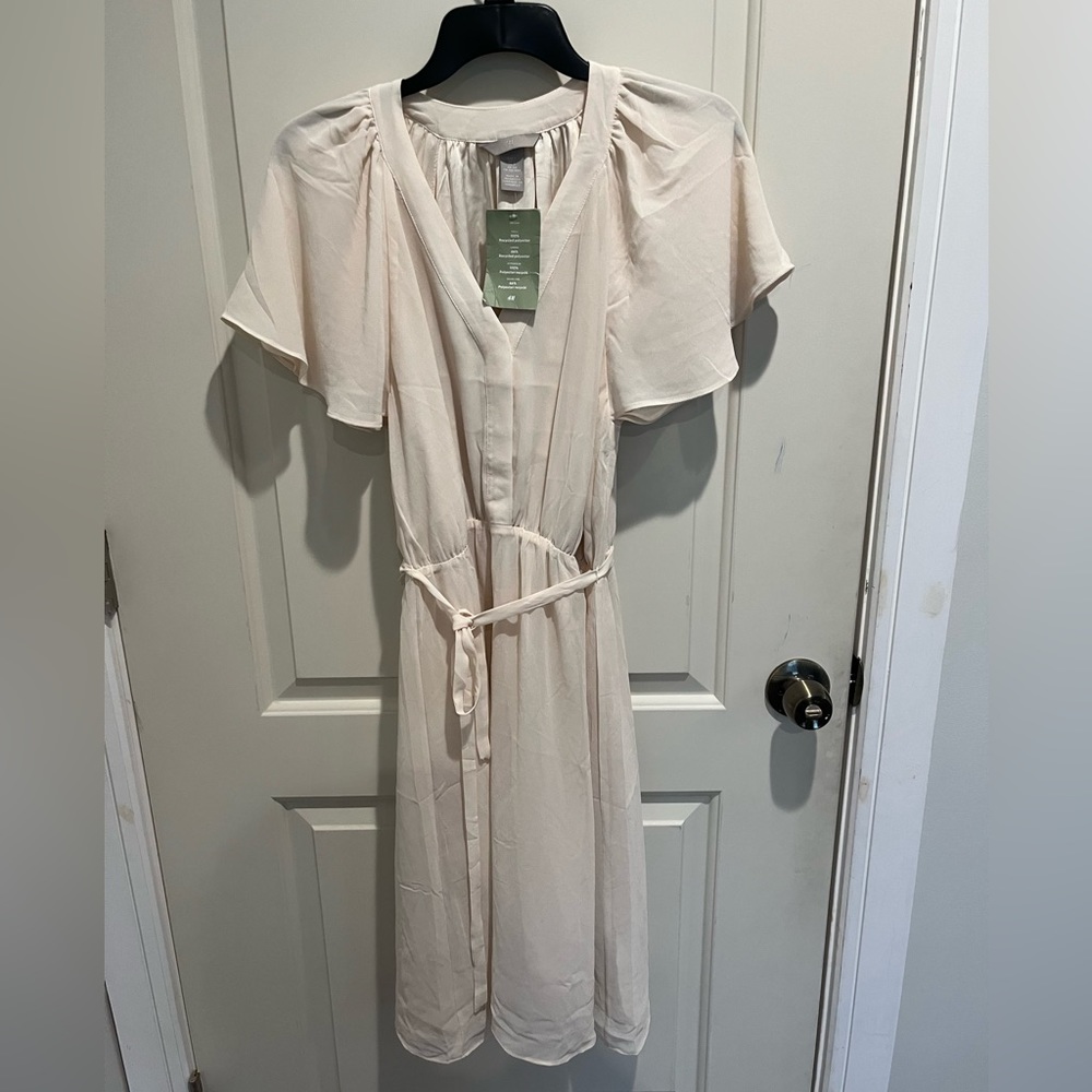 White H&M dress with tags still on in size small